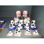 A selection of ceramic dog and cat figures