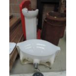 A bathroom pedestal sink