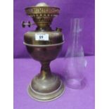 A brass bodied oil burning lamp