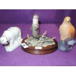 A selection of figures and figurines including Belleek polar bear