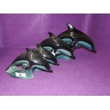 A selection of graduated ceramic Dolphin figures by Poole