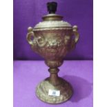 An antique cast urn as lamp with cherub and twin handle design