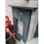 A Victorian style cast fire place and grate