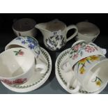 A selection of tea cups and saucers by Portmeirion botanical pattern