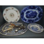 A selection of serving plates and chargers including blue flo