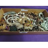 A selection of costume jewellery including necklaces and brooches