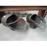 Two copper coal helmets