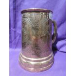 An Arts and Craft's period tankard hand worked with flora and fauna scenery