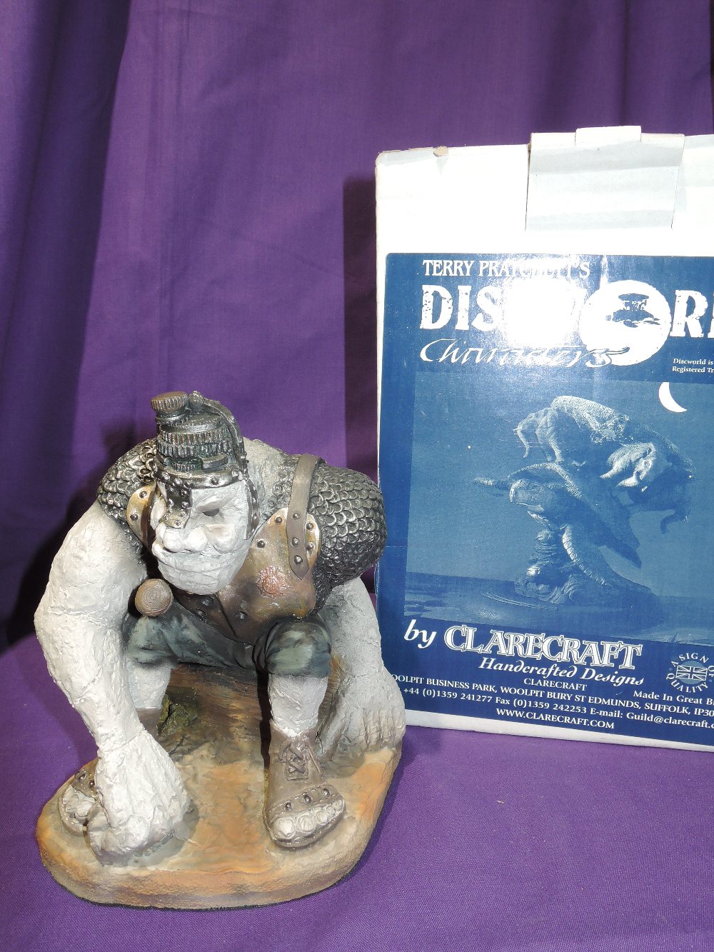 A figurine by Terry Pratchet Discworld Detritus with box