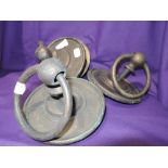 A selection of three large brass cast door handles and back plates