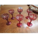 Six cut and etched ruby red spirit glasses