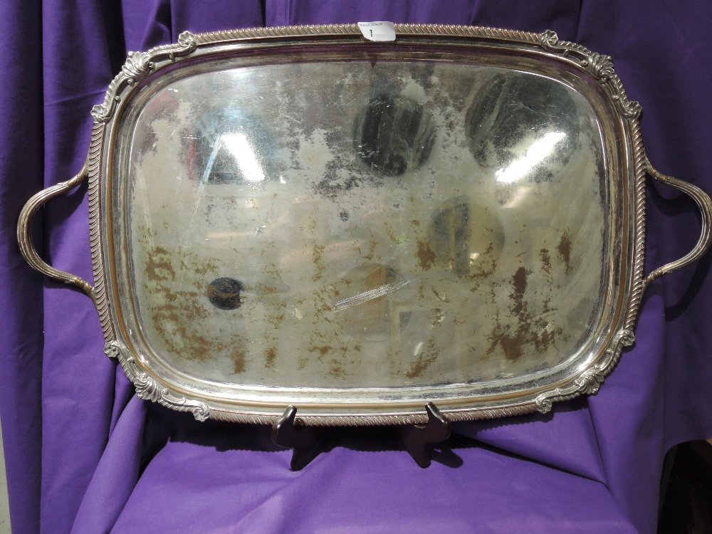 A Sheffield plate butlers tray having gadrooned rim with moulded rims and handles