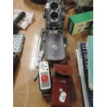 A Rolleiflex reflex photographic camera and accessories