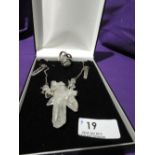 A three piece set of white metal and quartz jewellery including large pendant, drop earrings and