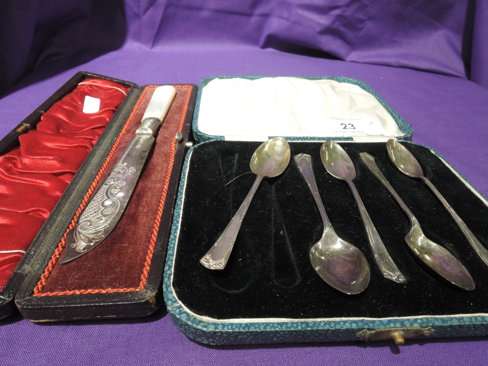 A cased part set (5) of HM silver teaspoons having moulded decoration and a cased Edwardian silver