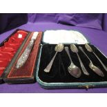 A cased part set (5) of HM silver teaspoons having moulded decoration and a cased Edwardian silver