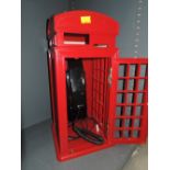 A Geemark phone housed in classic red telephone box