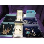 A selection of costume jewellery including hinged bangles, necklaces, Paua shell pendants etc