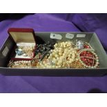 A selection of costume jewellery including simulated pearls, rosary beads, earrings etc