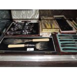 A small selection of cased and boxed flatware including fish servers, teaspoons etc