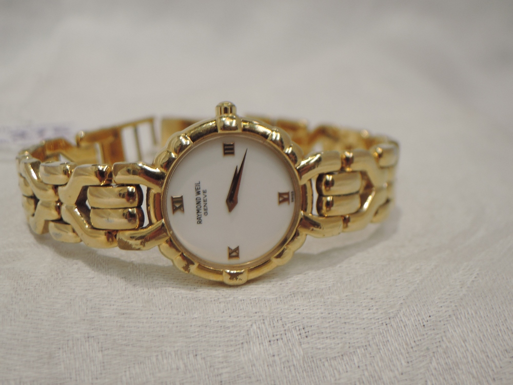 A lady's gold plated quartz wrist watch by Raymond Weil having a Roman numeral quarter hour dial