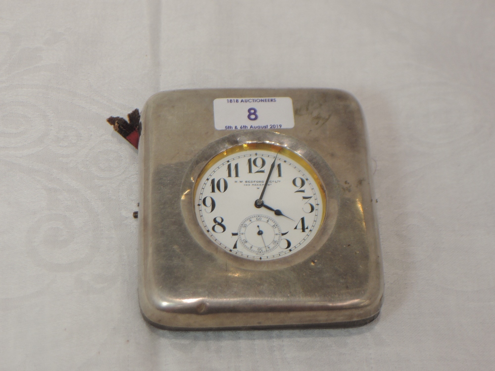 An Edwardian silver pocket watch stand of plain form having leather reverse, Chester 1904, Cornelius