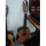 A vintage Kimbara acoustic guitar with hard case