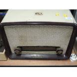 A vintage HMV radio in part phenolic case