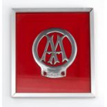 A framed vintage AA badge stamped 2065