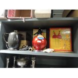 A selection of vintage items including soda syphon and clock
