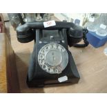 A vintage bakelite telephone with Call Exchange