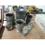 A selection of pewter tankards and similar