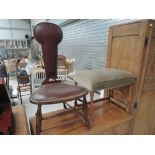 An Arts and Crafts style stained frame chair having leather studded seat and back