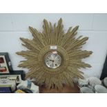 An art deco star burst wall clock