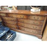 A reproduction Regency long low chest of drawers