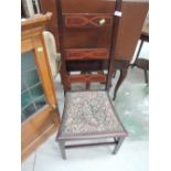 An Edwardian mahogany chair having high ladder back with inlay decoration with tapestry seat and