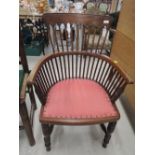 A Victorian mahogany spindle back carver chair having turned legs