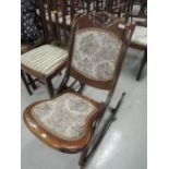 A traditional stained frame occasional rocking chair