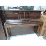 An early 20th Century mahogany upright piano, labelled Chappell, lid currently locked