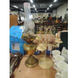 A selection of lighting including candle holder and oil lamp