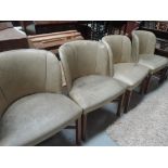 A set of four 1950's style lounge chairs in white vinyle