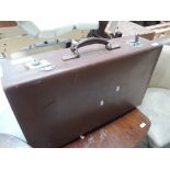 A leather bound suitcase