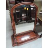 A Victorian mahogany toilet/swing mirror having lift base