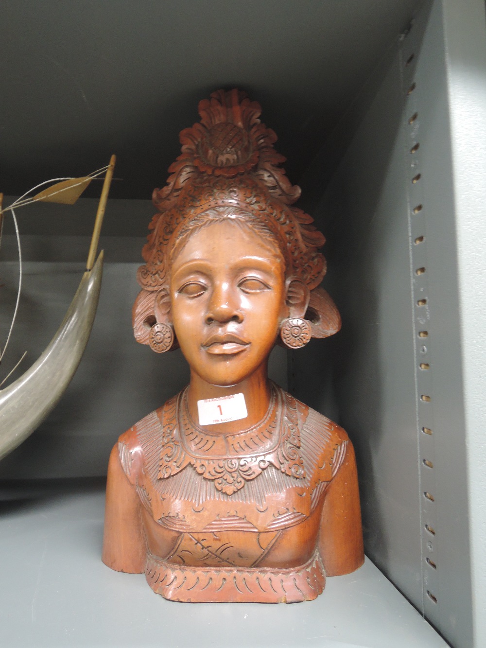 A heavy ethnic wood hand carved bust of a female deity or goddess scribed A'Fatimah Bali to base
