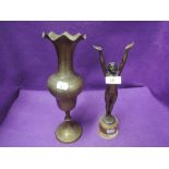 An art deco metal cast figure and brass urn