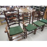 Three early 19th century elm vernacular matched dining chairs having ladder backs with rush seats