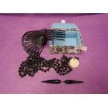 A small selection of black mourning jewellery including large hair comb, Dott brooch (AF) string