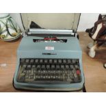 An Olivetti typewriter in teal blue Lettera 32
