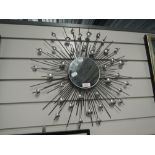 A star burst design wall mirror