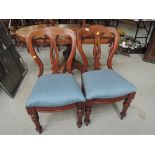 A pair of balloon back dining chairs